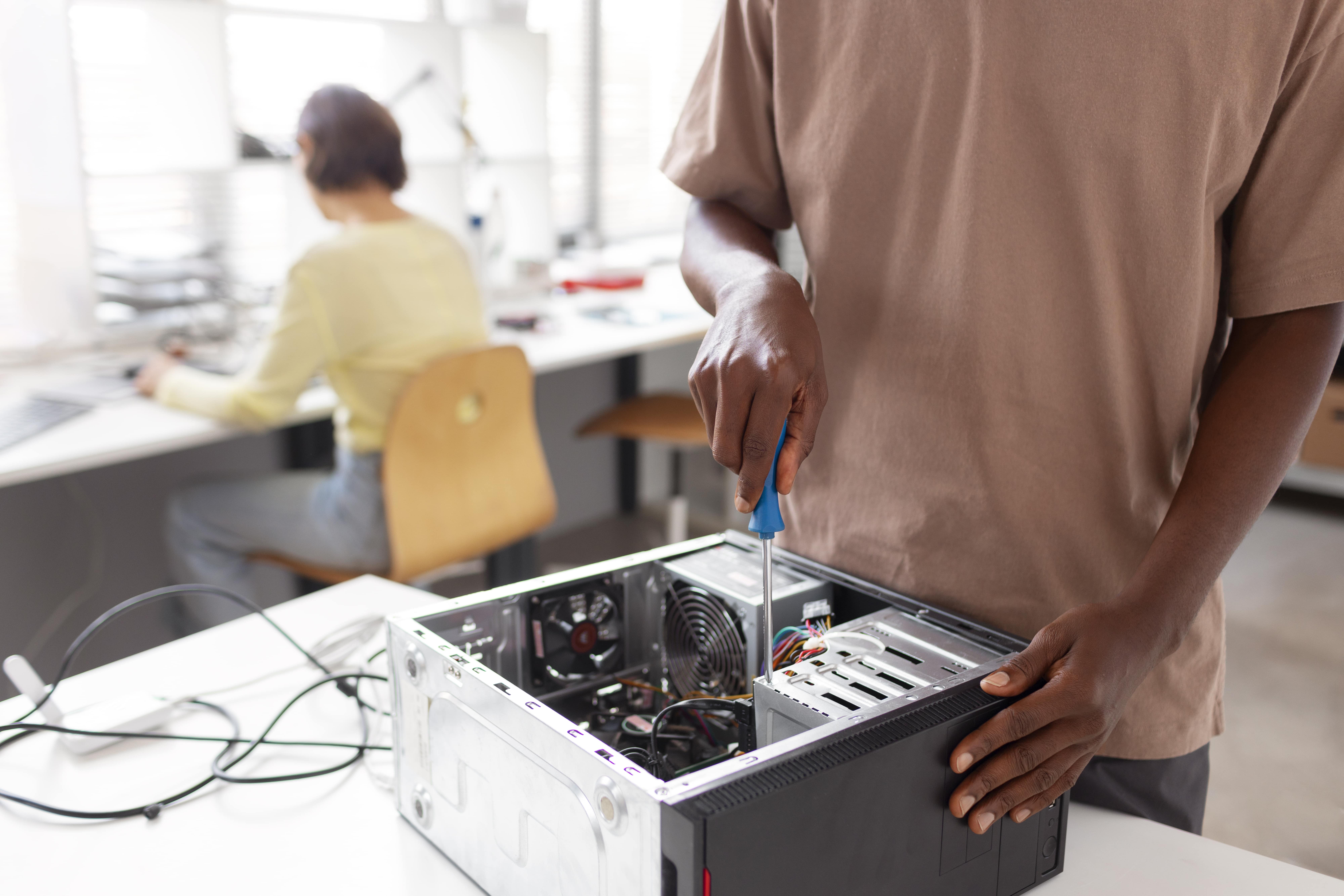 people-repairing-computer-chips-min