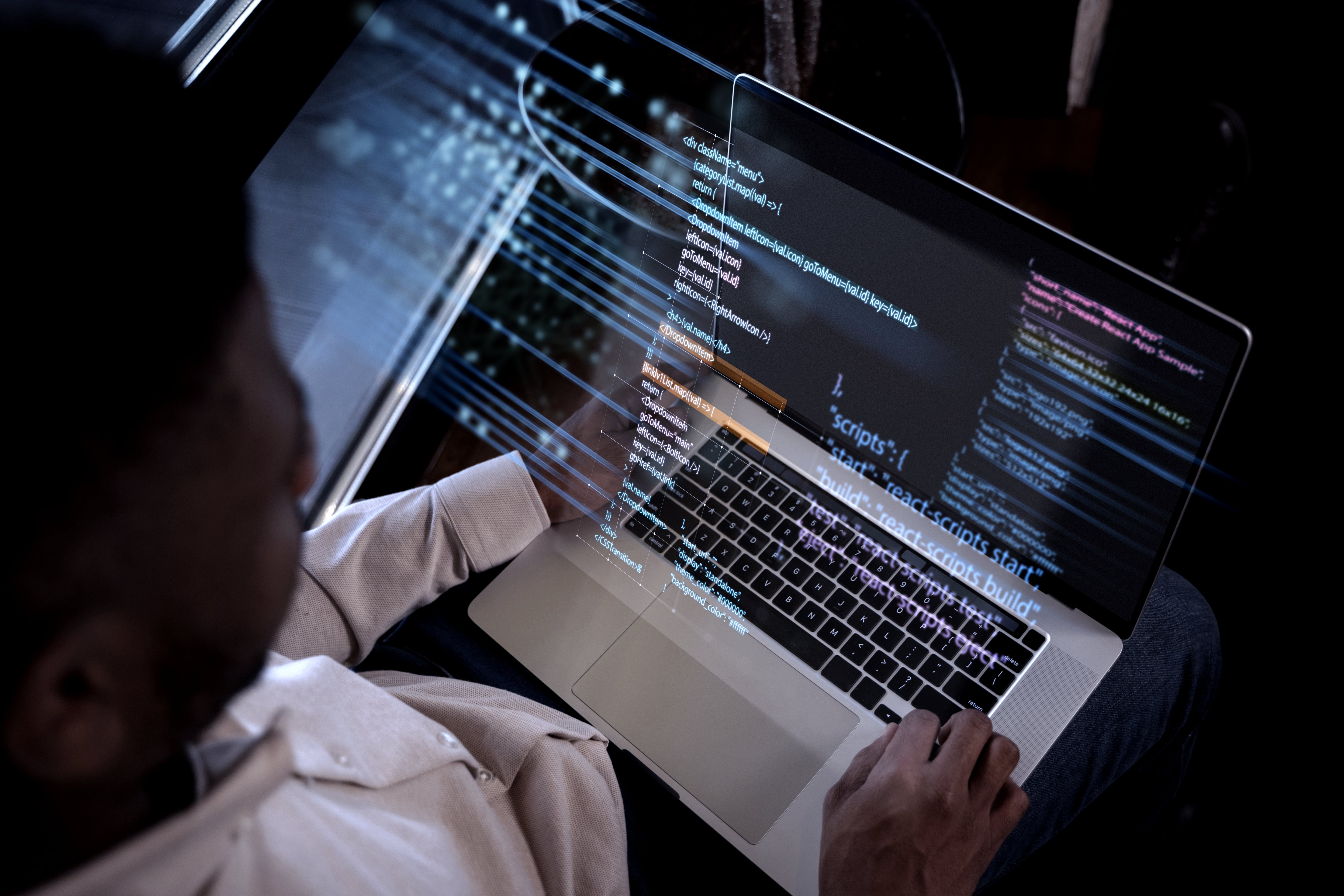 programming-background-with-person-working-with-codes-computer-min